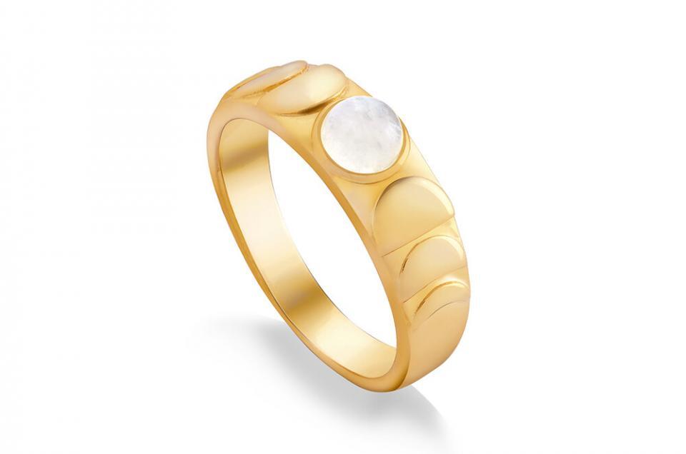 A gold ring with a moonstone that has the level 2 retouching including a shadow