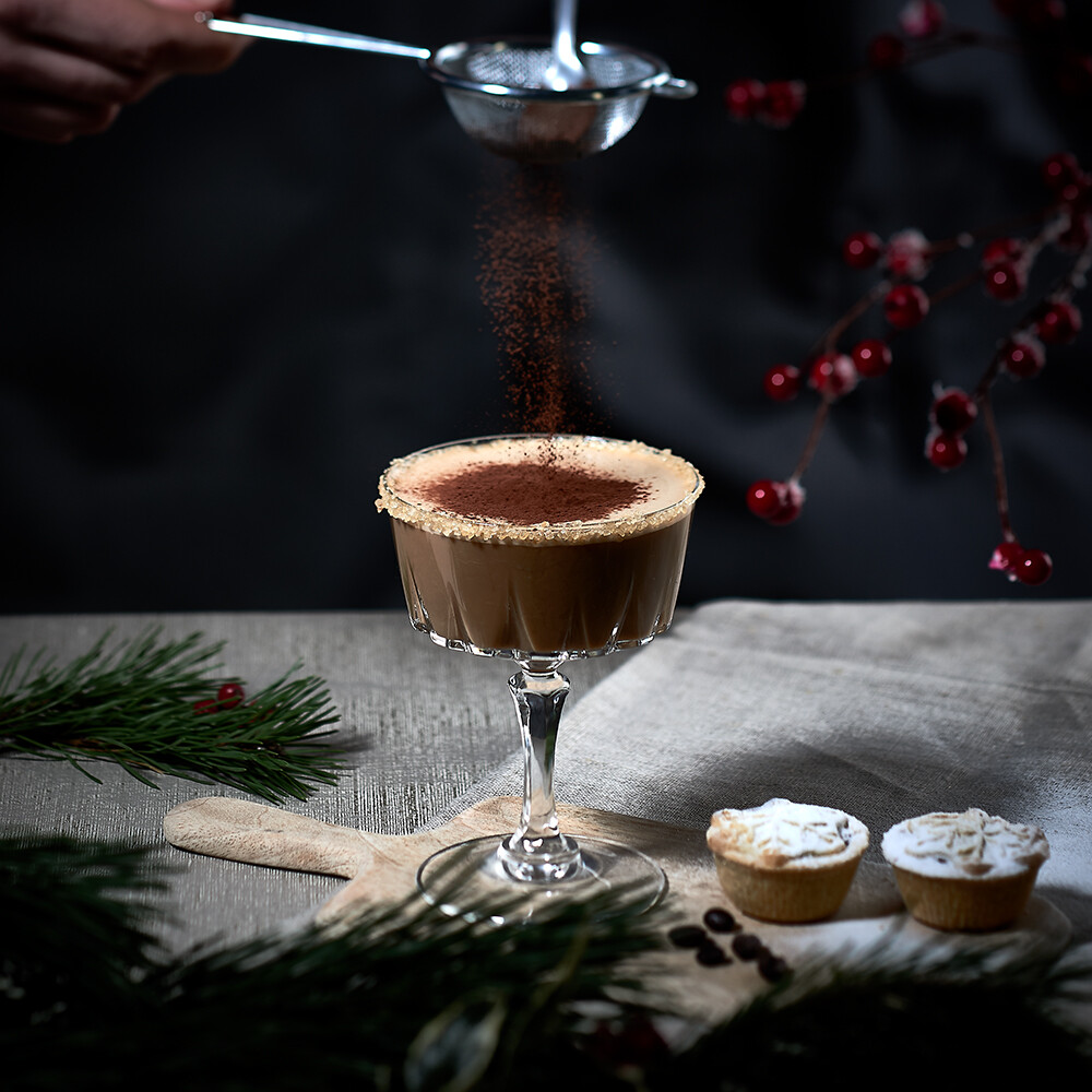 drink photography, Christmas White Russian drink image styled with with dry ice, festive fir and a glass bauble photography, Christmas Espresso Martini with mince pies and chocolate